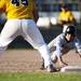 Skyline junior Justin Woods slides into the first base during the second game of a double header against Chelsea on Monday, April 22. Daniel Brenner I AnnArbor.com